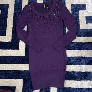 Purple sweater dress with black rhinestones.